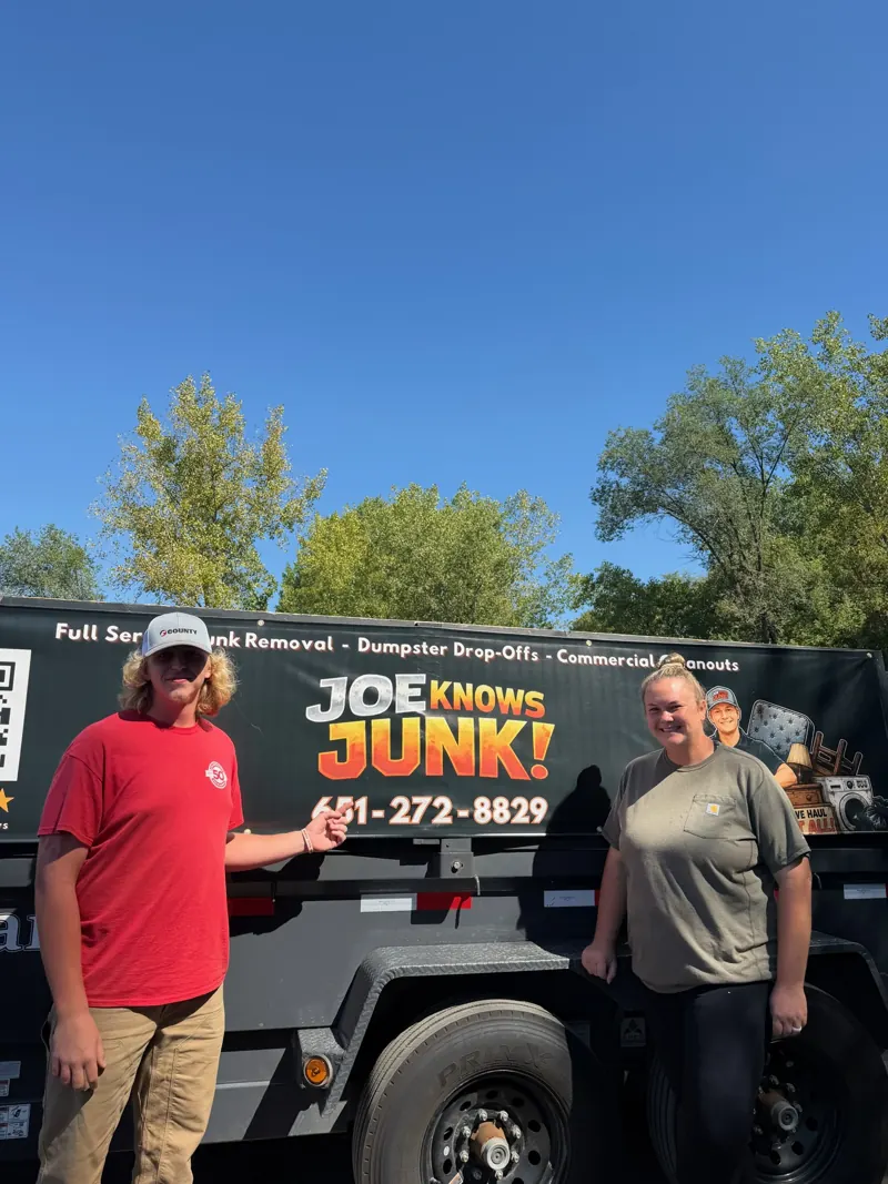 Customers next to the Joe Knows Junk trailer