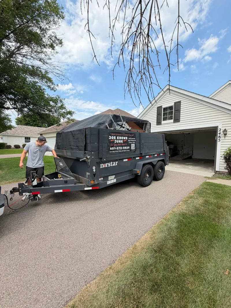 Trailer backed up to a garage