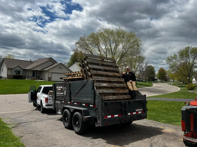 Trailer stacked with old pallets